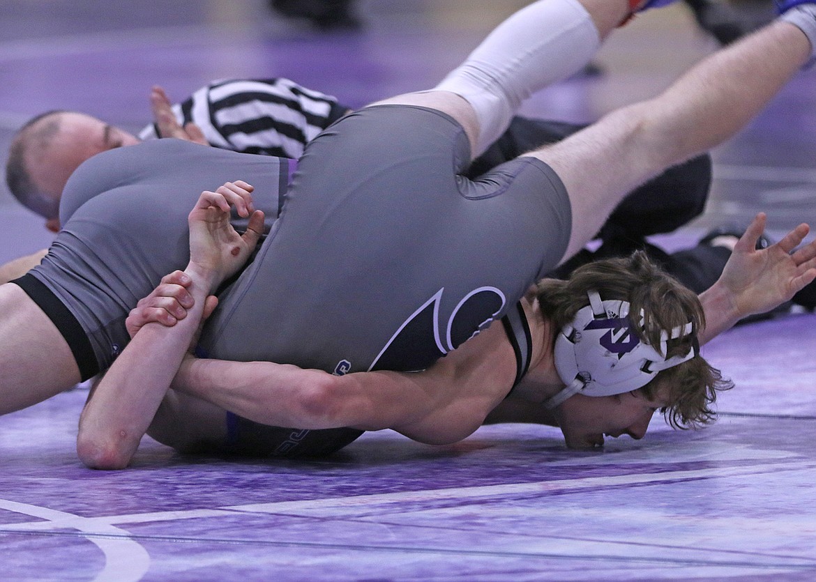 Polson senior Kedrick Baker pinned his Columbia Falls opponent in the 126-pound class on Senior Night in Polson. (Bob Gunderson photo)