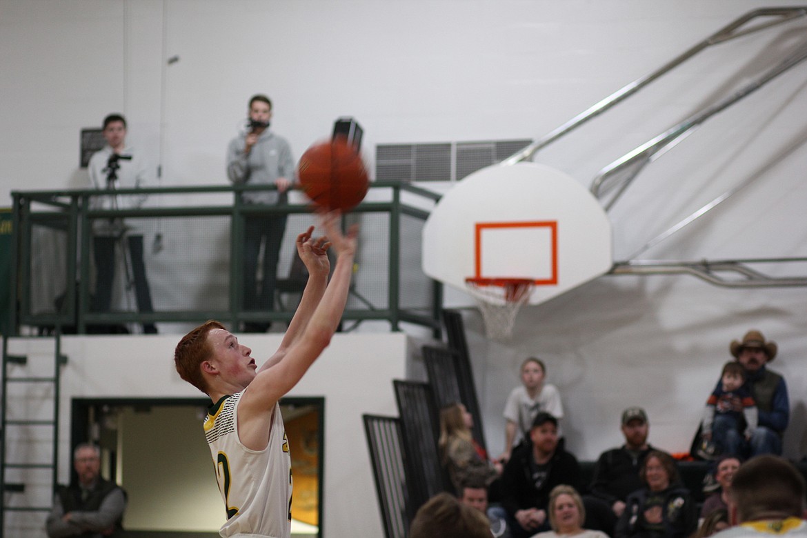 St. Regis&#146; Tanner Day drops in two of his 25 points against Charlo. (Chuck Bandel/Mineral Independent)