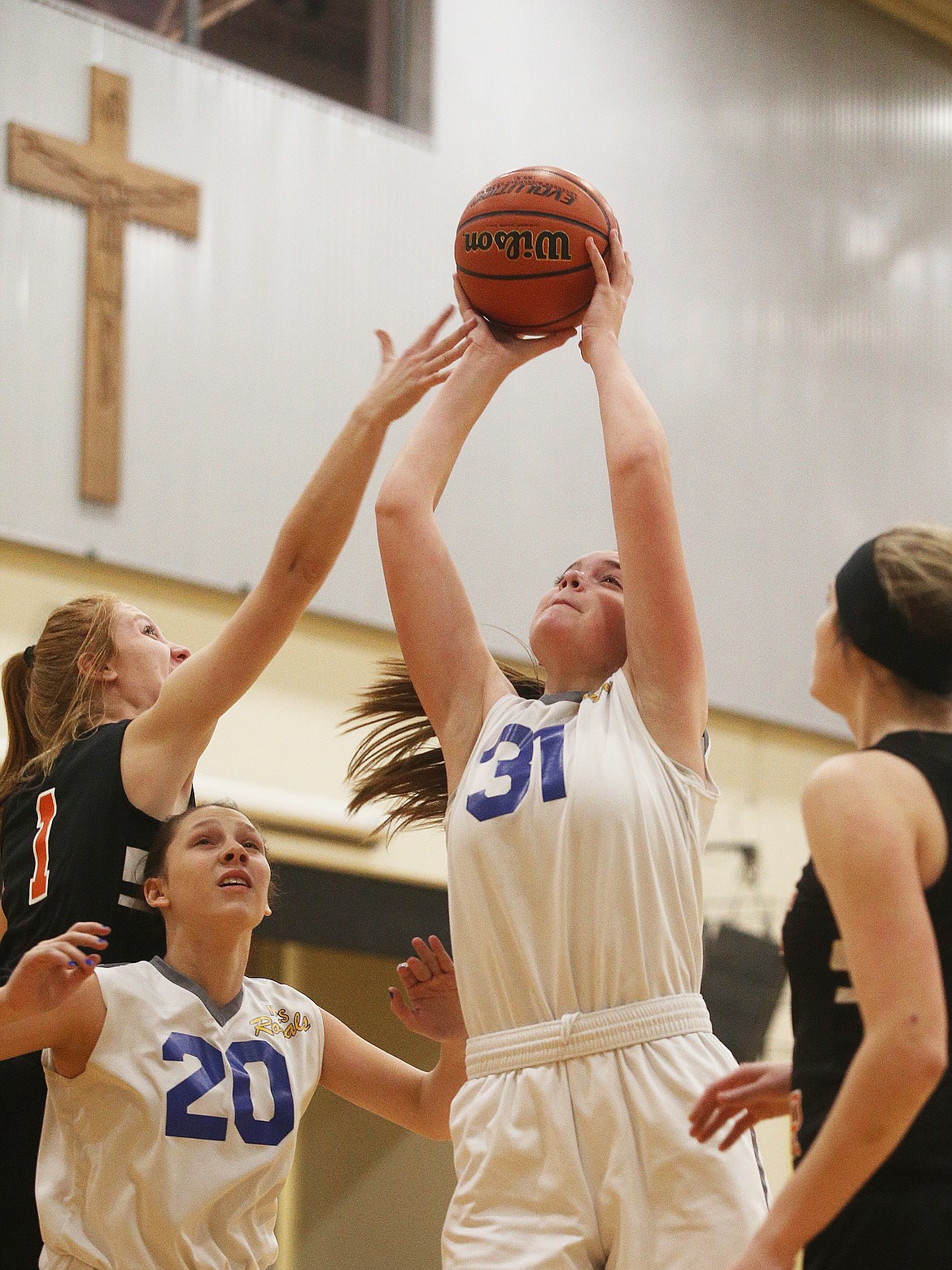 North Idaho Christians Imelda Bresee gathers a rebound in a game against Priest River last Wedneday at Holy Family Catholic School in Coeur dAlene.