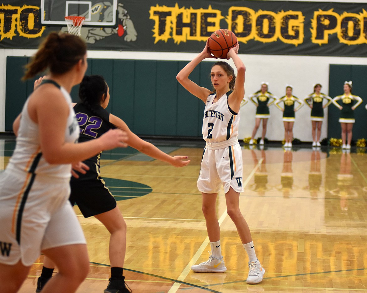 Whitefish sophomore Erin Wilde looks to make a pass Friday night as the Lady Bulldogs took on the Polson Pirates at home. (Heidi Desch/Whitefish Pilot)