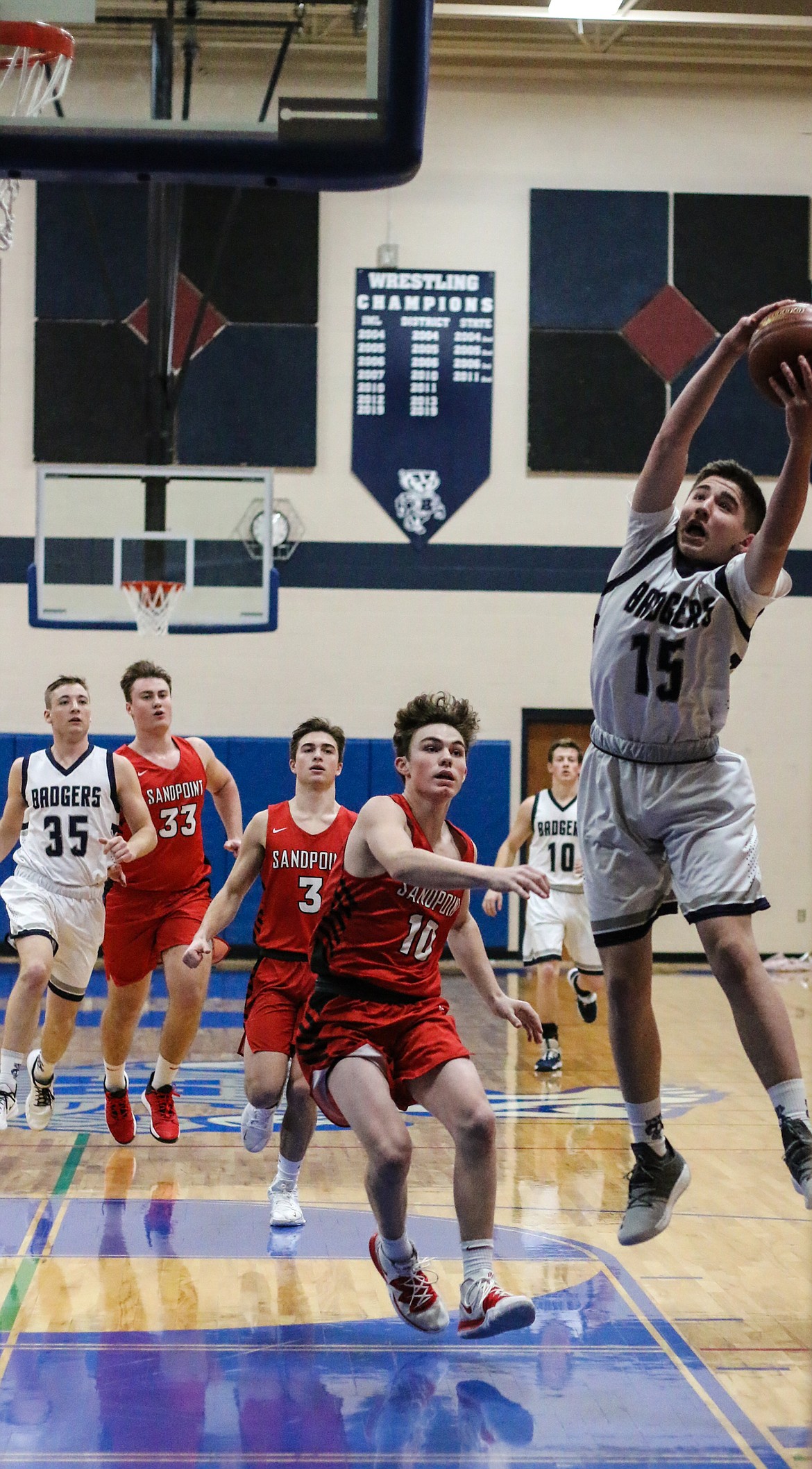 Photo by MANDI BATEMAN 
Ethan Hubbard drives to the basket during last week&#146;s game against Sandpoint High School.