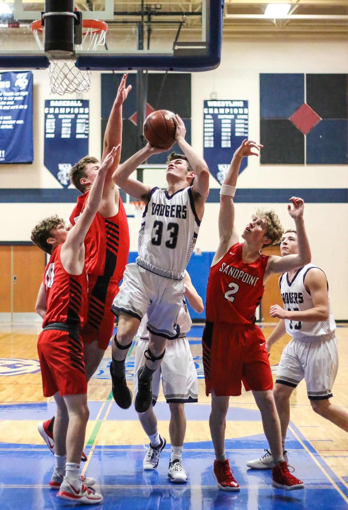 Photo by MANDI BATEMAN 
Braeden Blackmore powers through a sea of opponents during last week&#146;s home game.