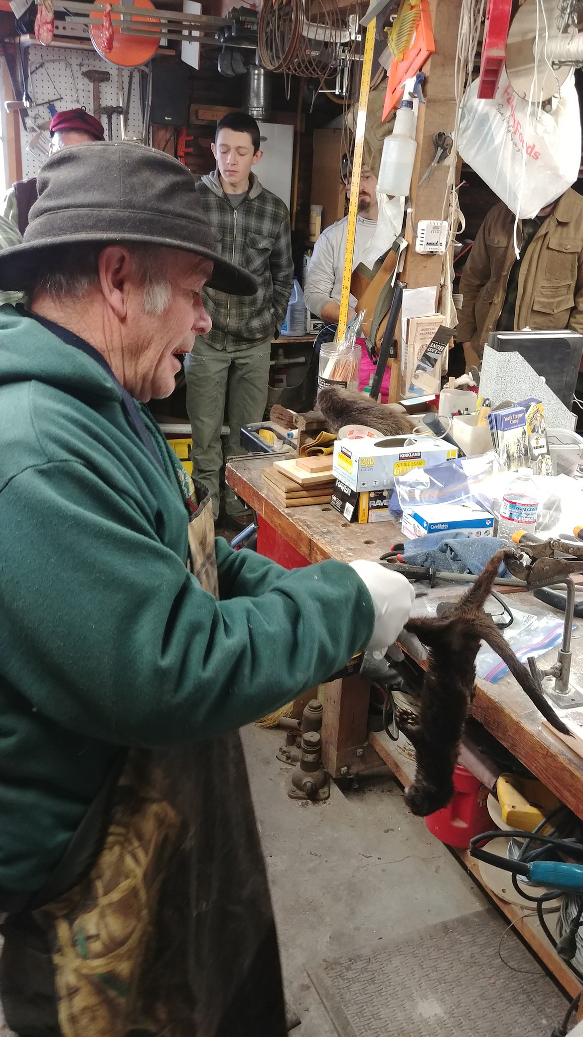 Bob Shepard, trapping legend, skins a mink. (Chuck Bandel/Valley Press)