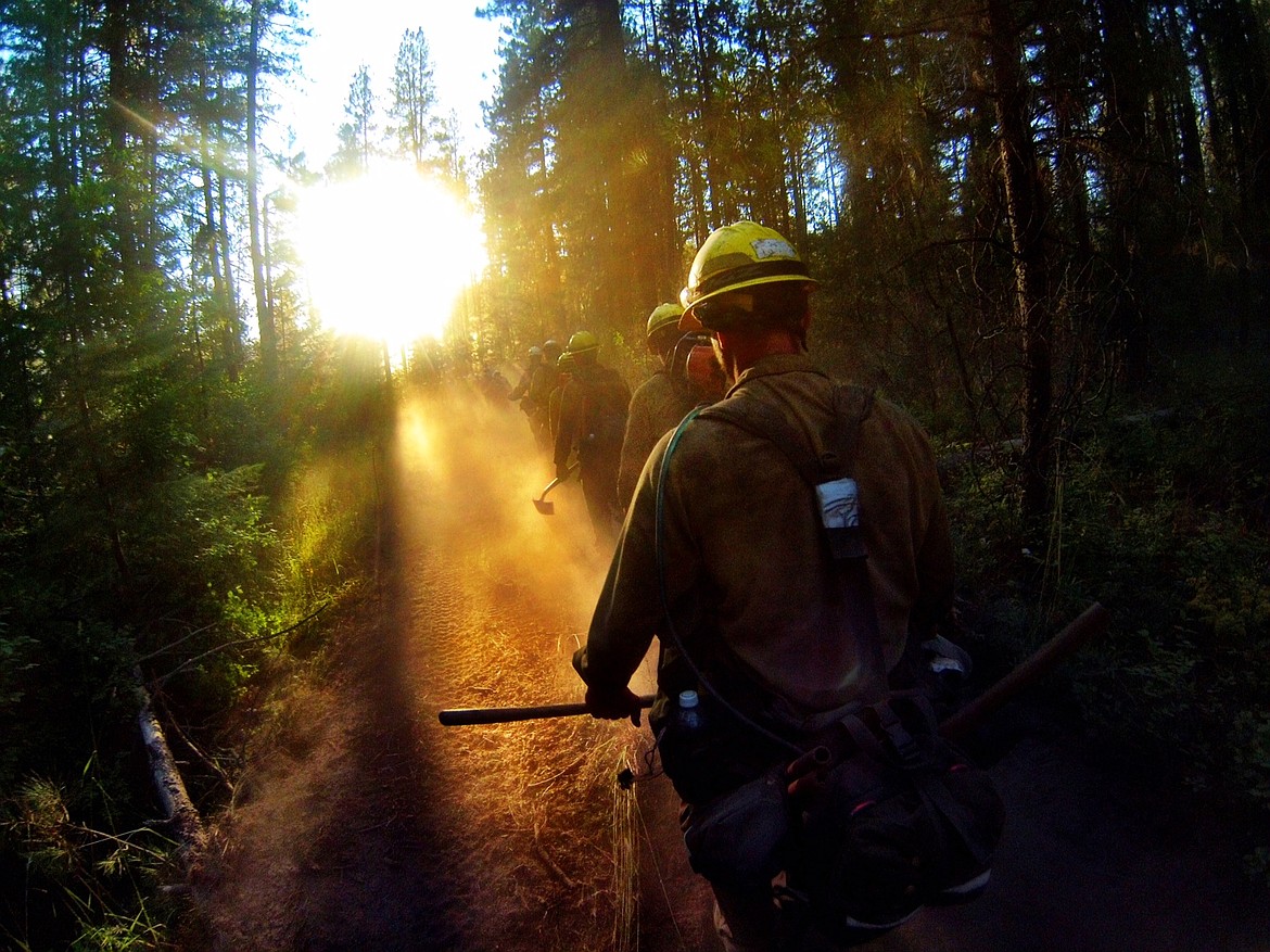 Photo courtesy of Charles Vaught
The Highlands 20, an initial attack handcrew, based out of the Sinlahekin Valley in North Central Washington, walks towards an active fire. Charles Vaught recently published &#147;State of Fire,&#148; detailing his experience working on the wildland firefighting crew.