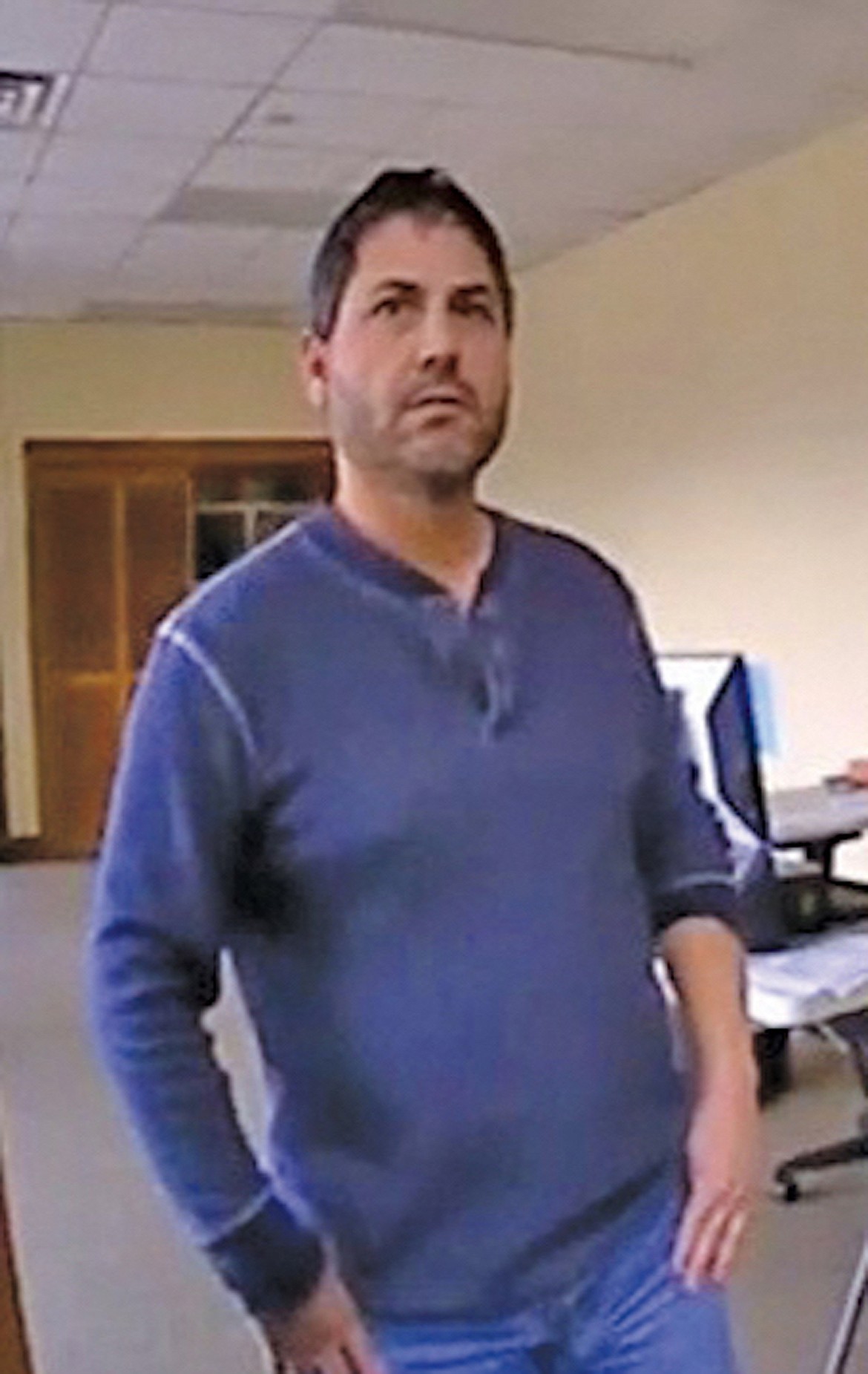This Sandpoint Police Department body cam photo shows Scott D. Rhodes at the door of his Division Street publishing office in late-2017, as law enforcement officials confronted him about video footage that showed him placing anti-Semitic media on vehicles at Sandpoint High School.