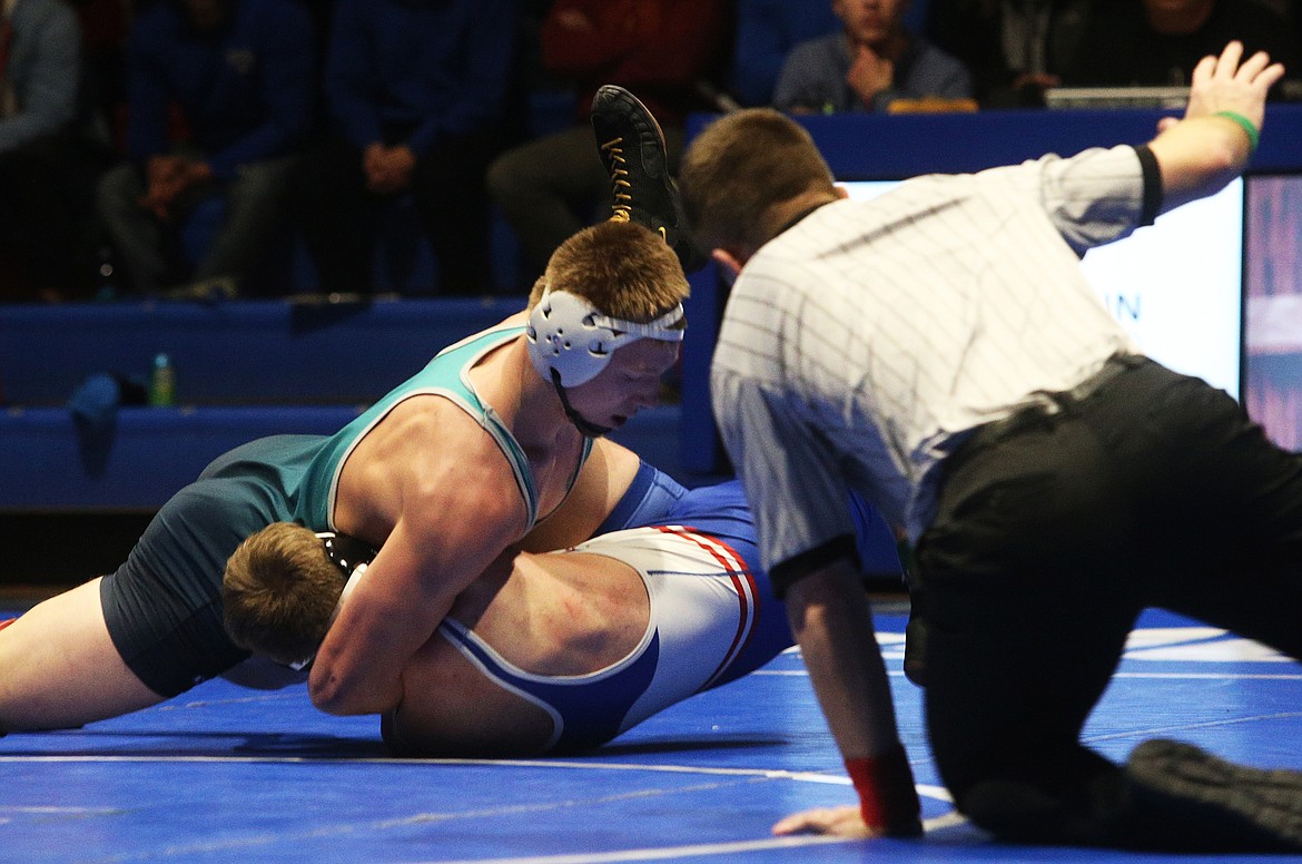 Lake City&#146;s Matthew Whitcomb pinned Coeur d&#146;Alene&#146;s Andrew Stockham in 1 minute, and six seconds at the Terhark Cup Wednesday at Coeur d&#146;Alene High. (LOREN BENOIT/Press)