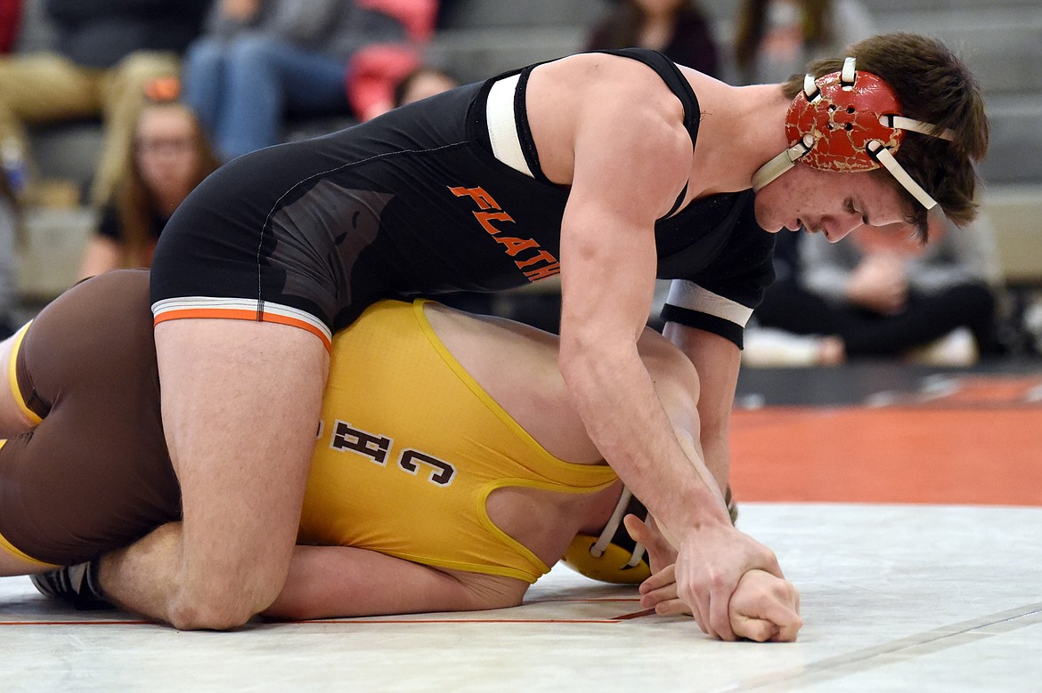 Flathead's Tanner Russell works toward a pin of Helena Capital's Tucker Zanto at 170 lbs. at Flathead High School on Thursday. (Casey Kreider/Daily Inter Lake)