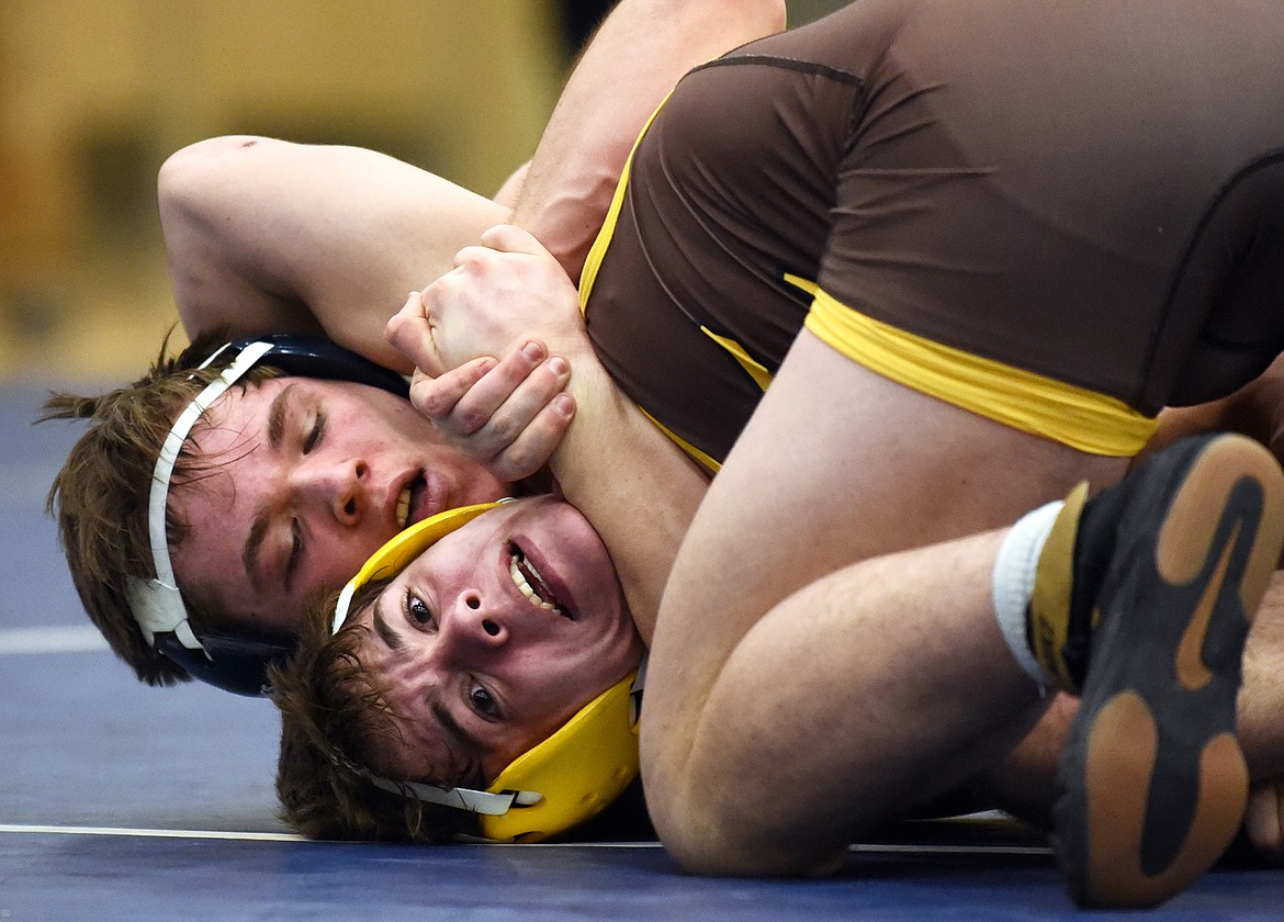 Glacier's Caden Gilmond wrestles Helena Capital's Ian Isaacson at Glacier High School on Thursday. Gilmond won by decision. (Casey Kreider/Daily Inter Lake)