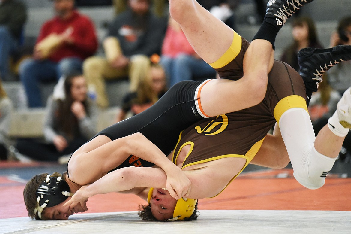 Flathead's Brendan Barnes wrestles Helena Capital's Conner Kovick at 138 lbs. at Flathead High School on Thursday. Kovick won by decision. (Casey Kreider/Daily Inter Lake)