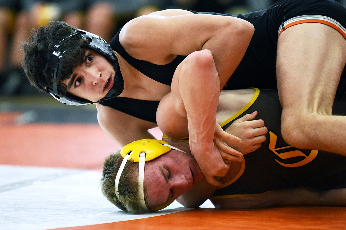 Flathead's Asher Kemppainen wrestles Helena Capital's Tyler Tobel at 132 lbs. at Flathead High School on Thursday. Kemppainen won by technical fall. (Casey Kreider/Daily Inter Lake)