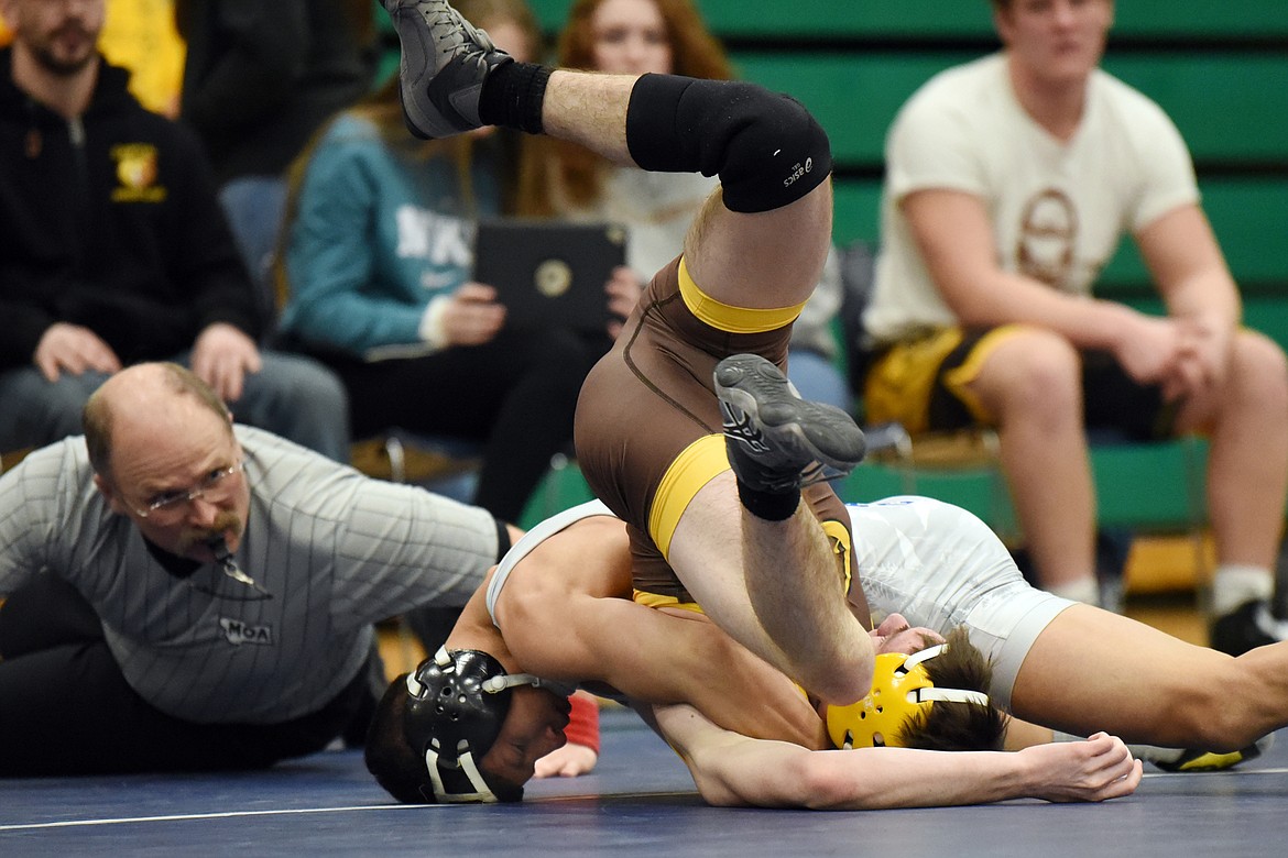 Glacier's Teegan Vasquez works toward a pin of Helena Capital's Lane O'Shea at Glacier High School on Thursday. (Casey Kreider/Daily Inter Lake)