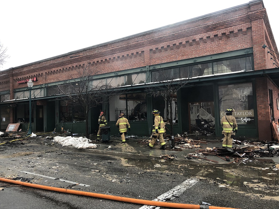 Coeur d'Alene firefighters sort through the rubble of a major fire at the corner of Lakeside Avenue and Fourth Street in downtown Coeur d'Alene early  in the morning Jan. 20.
MIKE PATRICK/Press