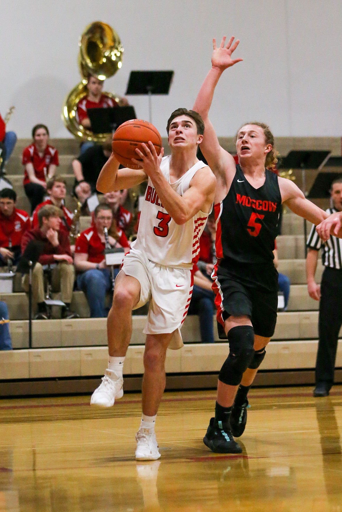 (Photo courtesy of JASON DUCHOW PHOTOGRAPHY)
Senior Christian Niemela drives toward the basket and converts a layup Saturday night.