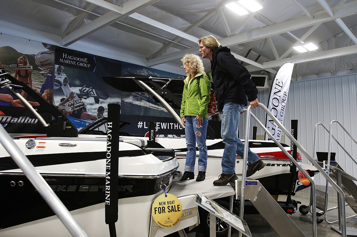 James and Wendy Wynd look at a Malibu boat in one of the showrooms at the Coeur d'Alene Boat Expo Wednesday at the Hagadone Marine Center. (LOREN BENOIT/Press)