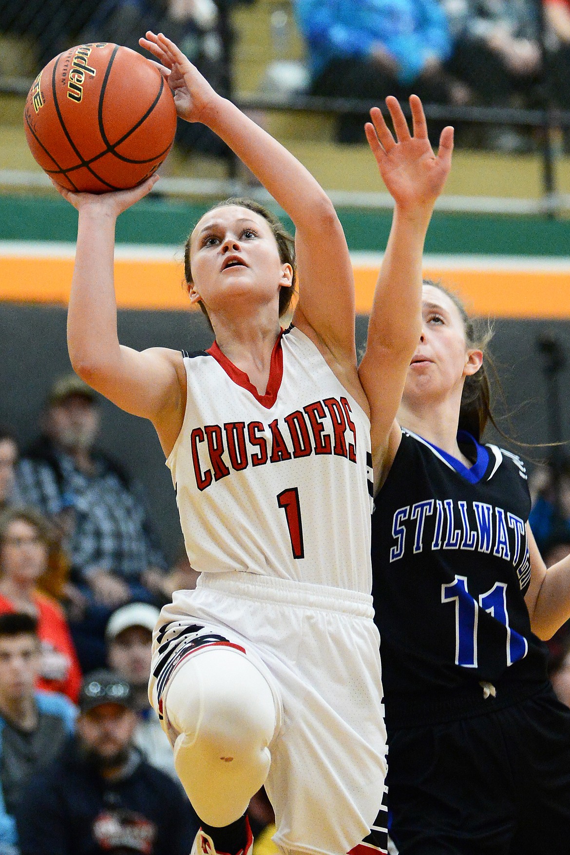 Flathead Valley Home School's Aurora Howery (1) drives to the hoop against Stillwater Christian's Grace Anderson (11) at Kalispell Middle School on Saturday. (Casey Kreider/Daily Inter Lake)