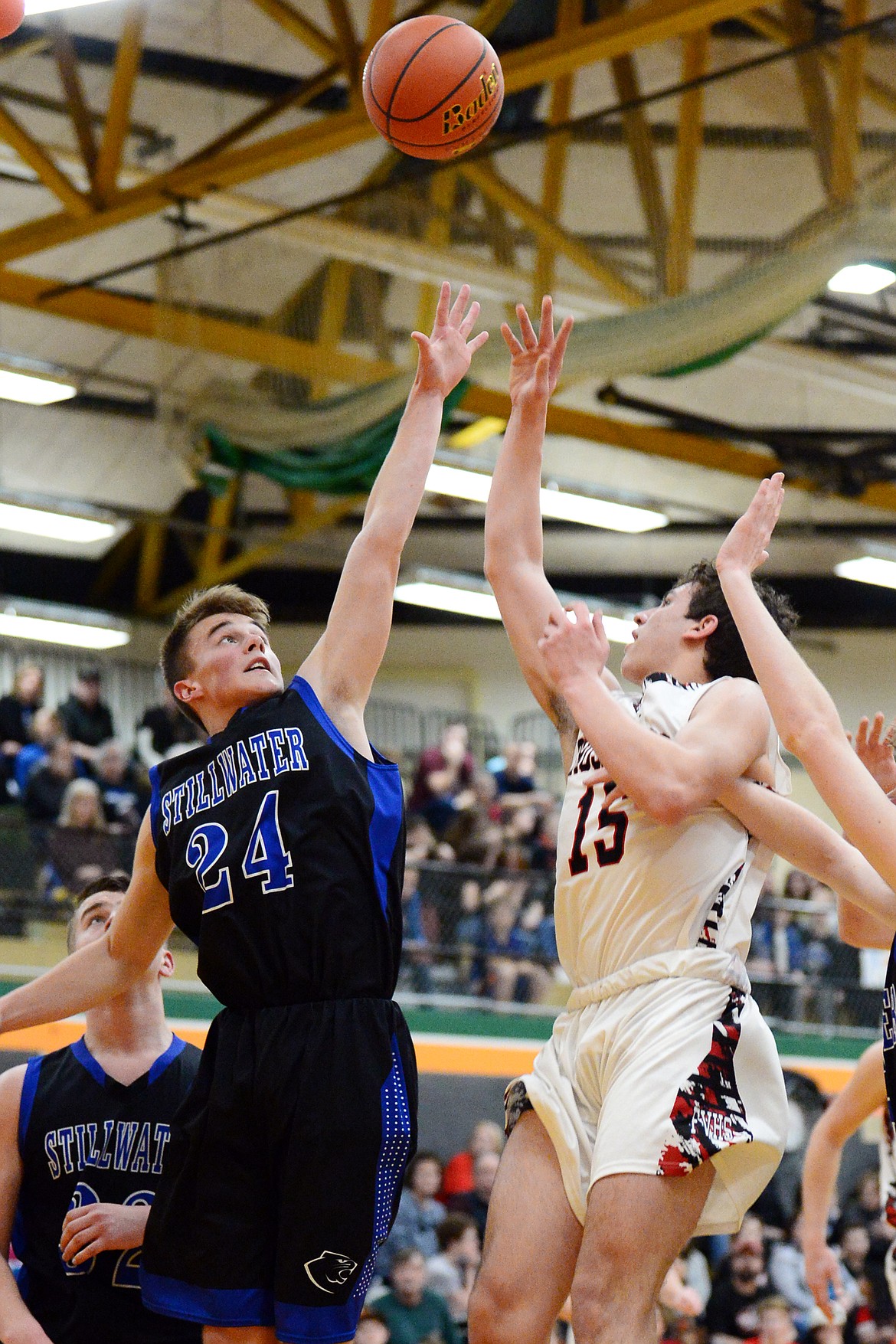 Stillwater Christian's Caleb Cole-Tinkham (24) defends against Flathead Valley Home School's Lee Artyomenko (15) at Kalispell Middle School on Saturday. (Casey Kreider/Daily Inter Lake)