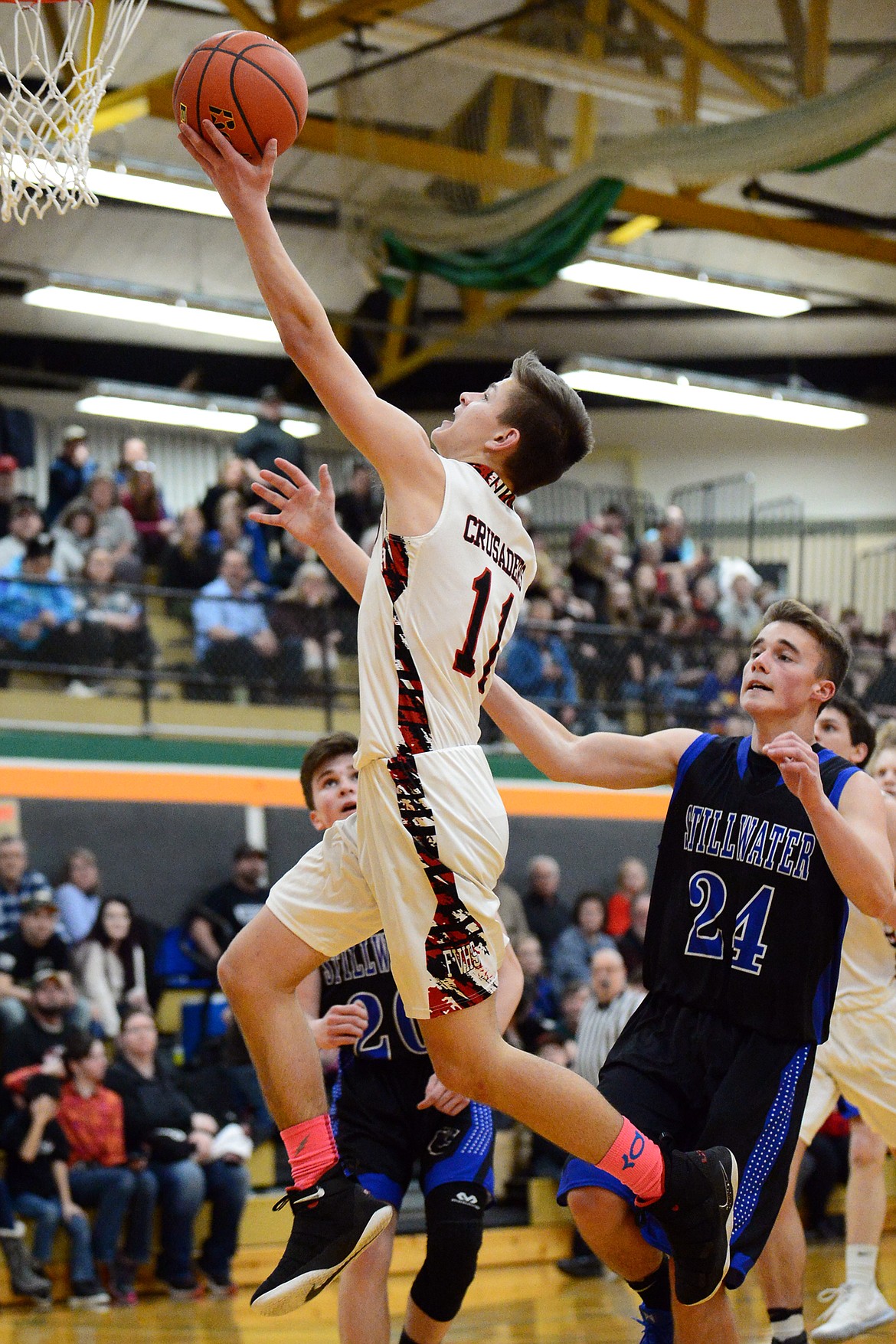 Flathead Valley Home School's Eli Husted (11) drives to the hoop against Stillwater Christian School at Kalispell Middle School on Saturday. (Casey Kreider/Daily Inter Lake)