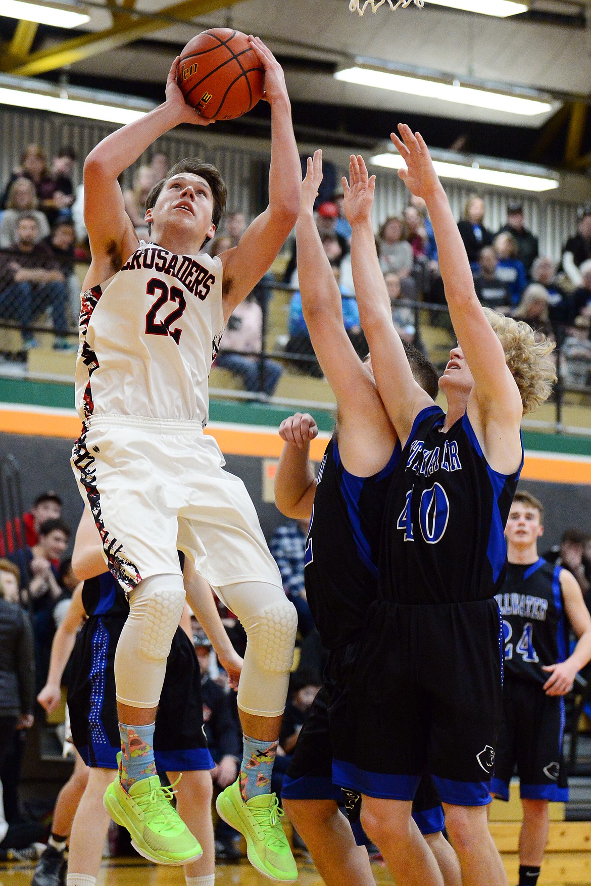 Flathead Valley Home School's Bubba Loyda (22) goes to the hoop against Stillwater Christian at Kalispell Middle School on Saturday. (Casey Kreider/Daily Inter Lake)