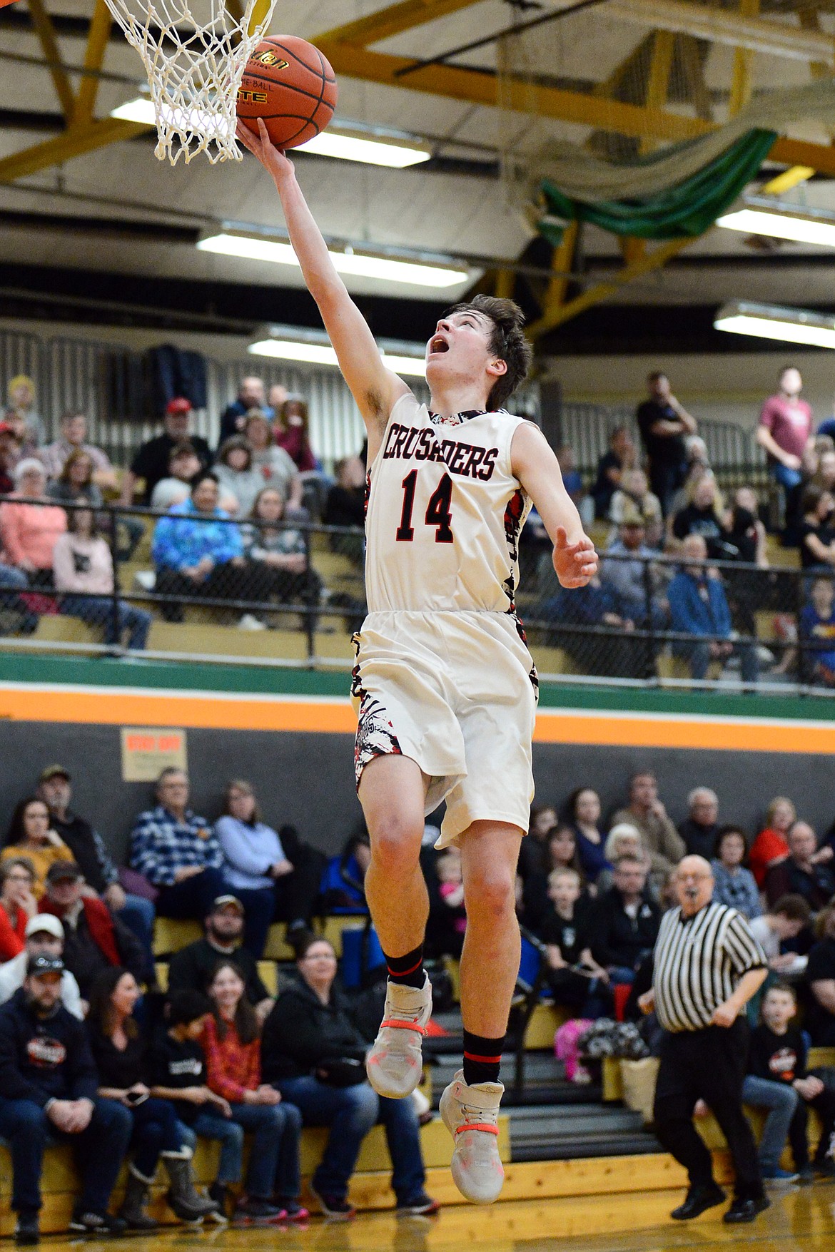 Flathead Valley Home School's Landan Wininger (14) lays in a bucket against Stillwater Christian at Kalispell Middle School on Saturday. (Casey Kreider/Daily Inter Lake)