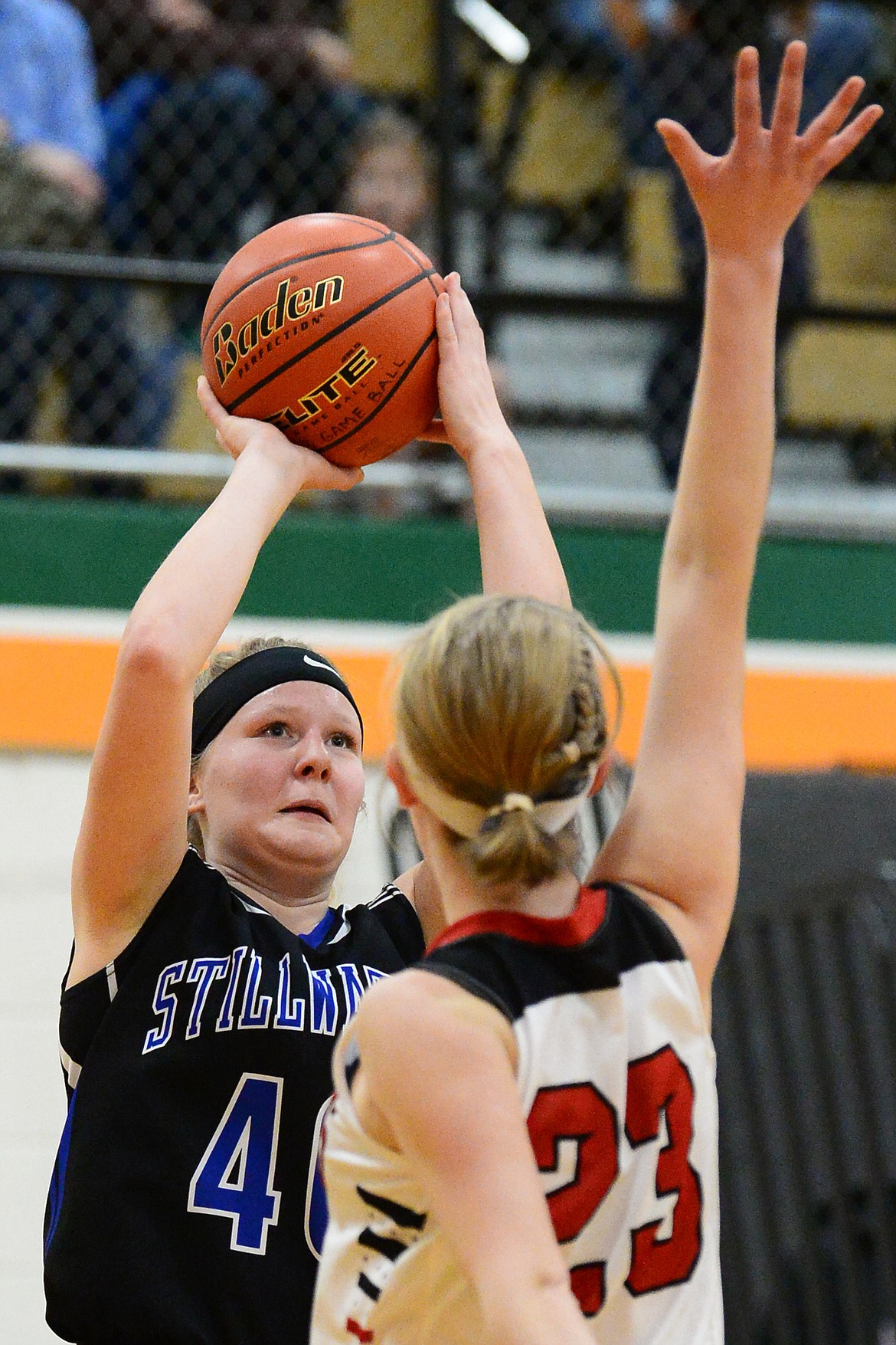 Stillwater Christian's Selah Neumann (40) shoots over Flathead Valley Home School's Hannah Buckner (23) at Kalispell Middle School on Saturday. (Casey Kreider/Daily Inter Lake)