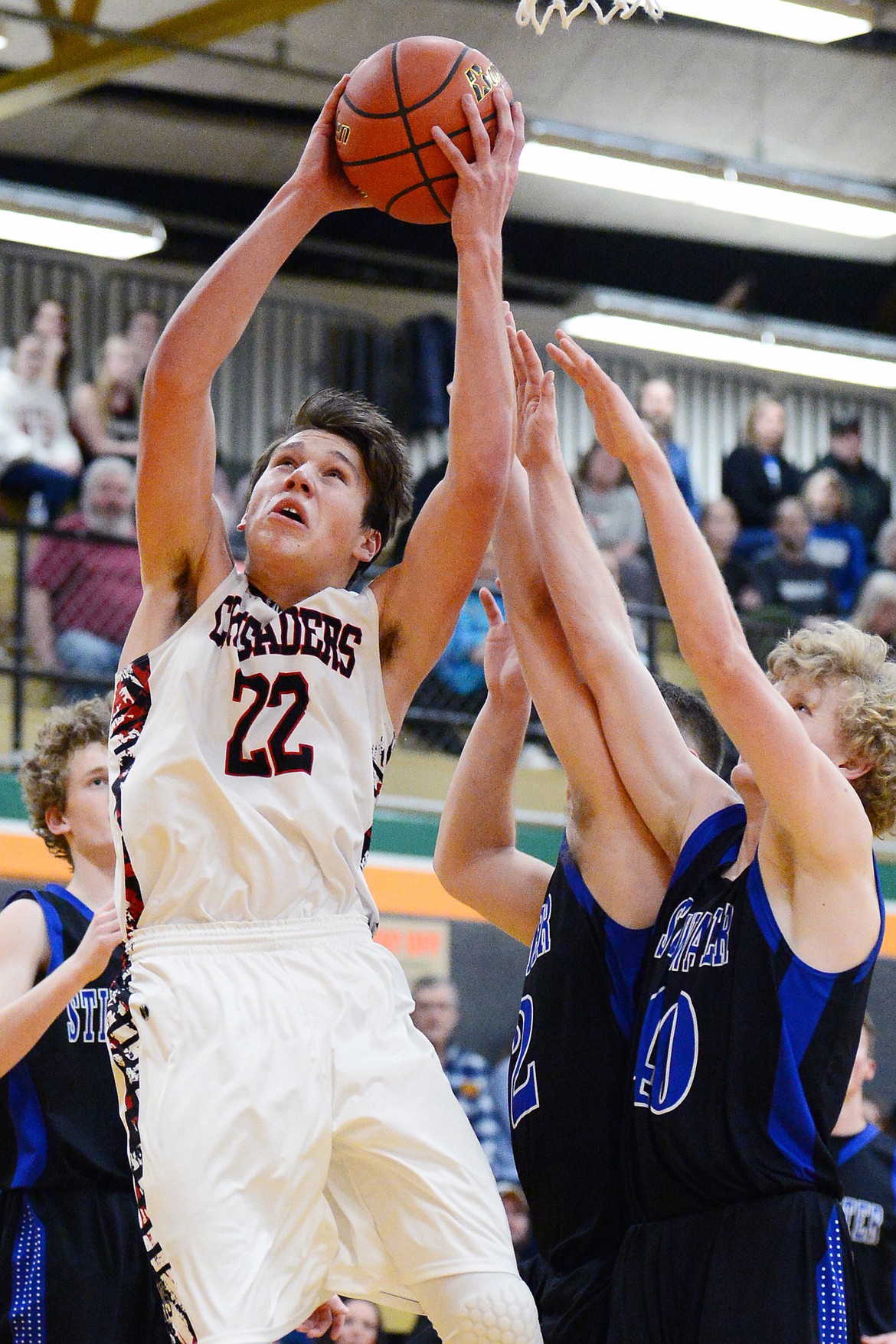 Flathead Valley Home School's Bubba Loyda (22) goes to the hoop against Stillwater Christian at Kalispell Middle School on Saturday. (Casey Kreider/Daily Inter Lake)