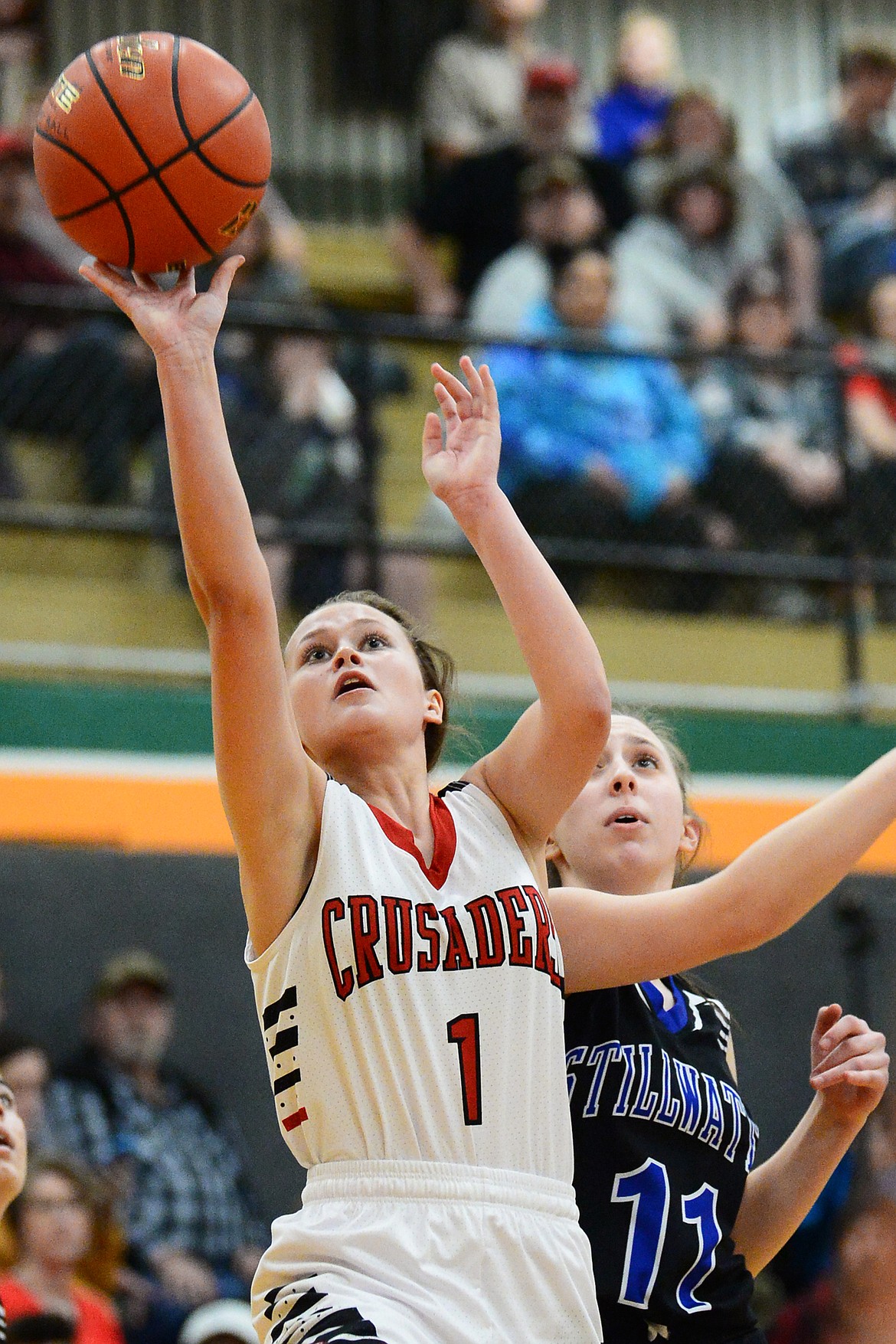 Flathead Valley Home School's Aurora Howery (1) drives to the hoop against Stillwater Christian's Grace Anderson (11) at Kalispell Middle School on Saturday. (Casey Kreider/Daily Inter Lake)