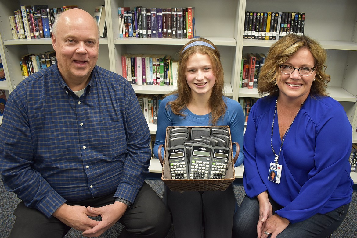 Courtesy photo
Recognizing that not every student has access to a calculator for use on certain standardized tests, Coeur d&#146;Alene High School junior Lilian Smith wanted to help. She secured more than $2,000 in grants from the CHS Vikings Booster Club and from Northwest Specialty Hospital &#151; enough to buy 250 new calculators for her school. Students got their first chance to use the calculators in October 2019 when they took the Preliminary Scholastic Aptitude Test. &#147;This is a cause I feel very passionate about: making my school a better place,&#148; Smith said. &#147;I believe that these calculators will give many of the students of Coeur d&#146;Alene High School the push they need to bigger and better things in this world.&#148; Lilian is pictured here with Rick Rasmussen, CEO at Northwest Specialty Hospital, and CHS Principal Libbi Barrett.