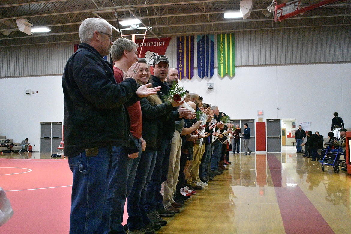 (Photo by DYLAN GREENE)
Sandpoint wrestling seniors and their families line up to celebrate senior night.