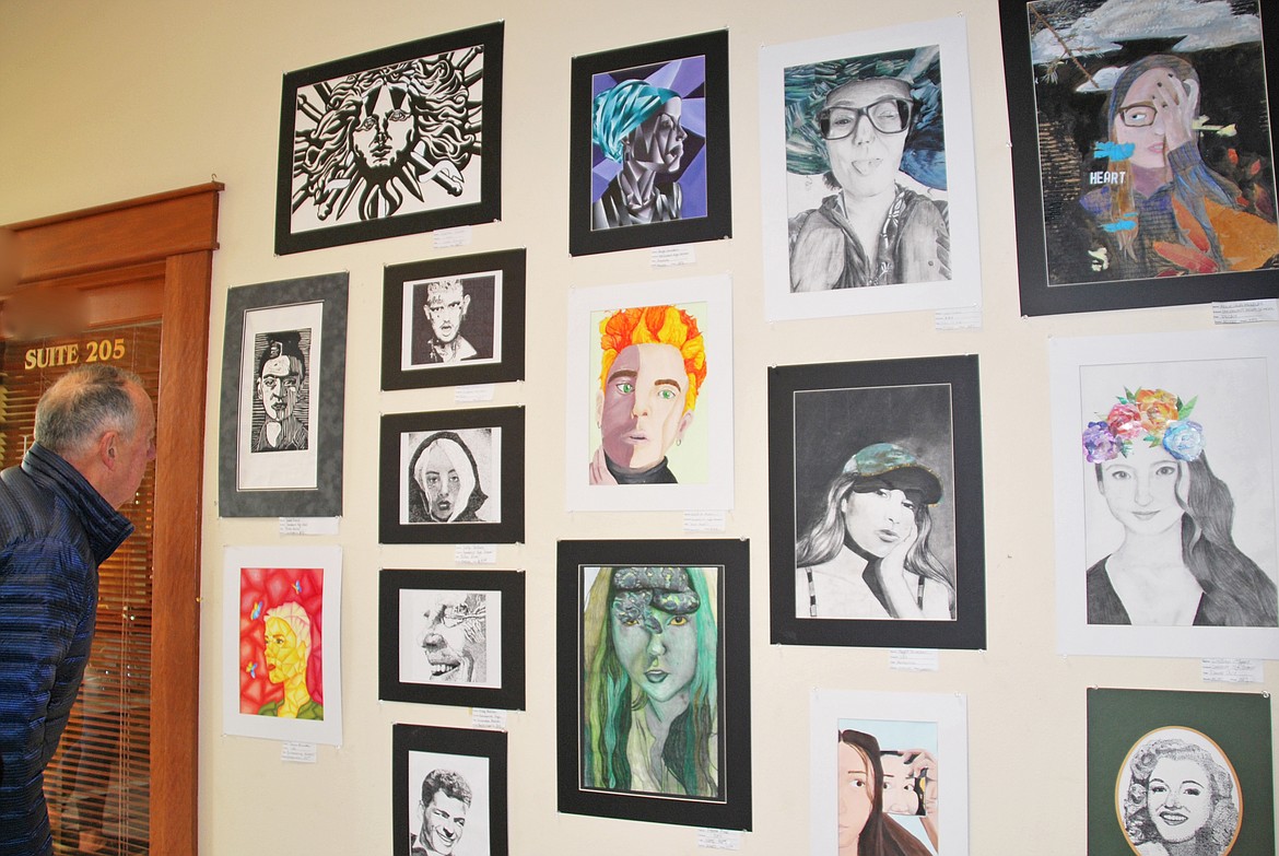 (Courtesy photo)Community residents enjoy the artwork at last year's student art show.