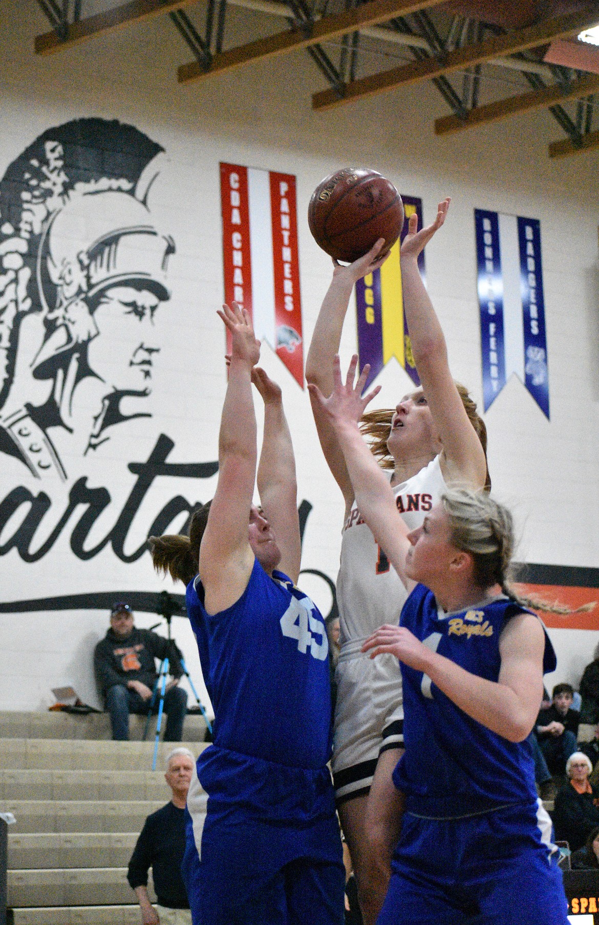 (Photo by DYLAN GREENE)
Junior Makia Fitzmorris drives just outside the paint and puts up a shot over two Royals defenders last Thursday.