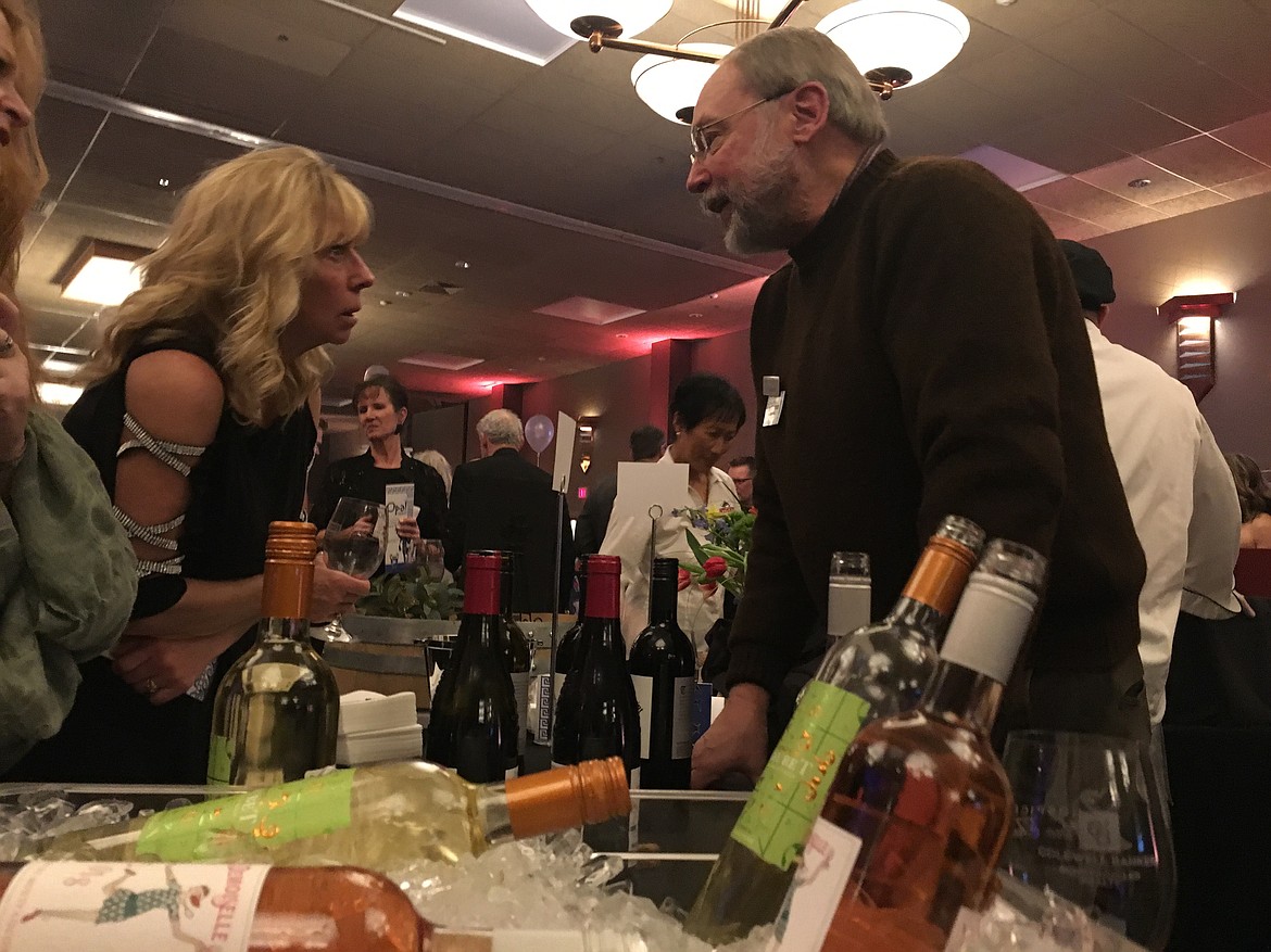 BILL BULEY/Press
Len Westman talks about wine with guests at the Hospice of North Idaho&#146;s 35th annual Hospice Wine Taste Saturday night at The Coeur d&#146;Alene Resort.