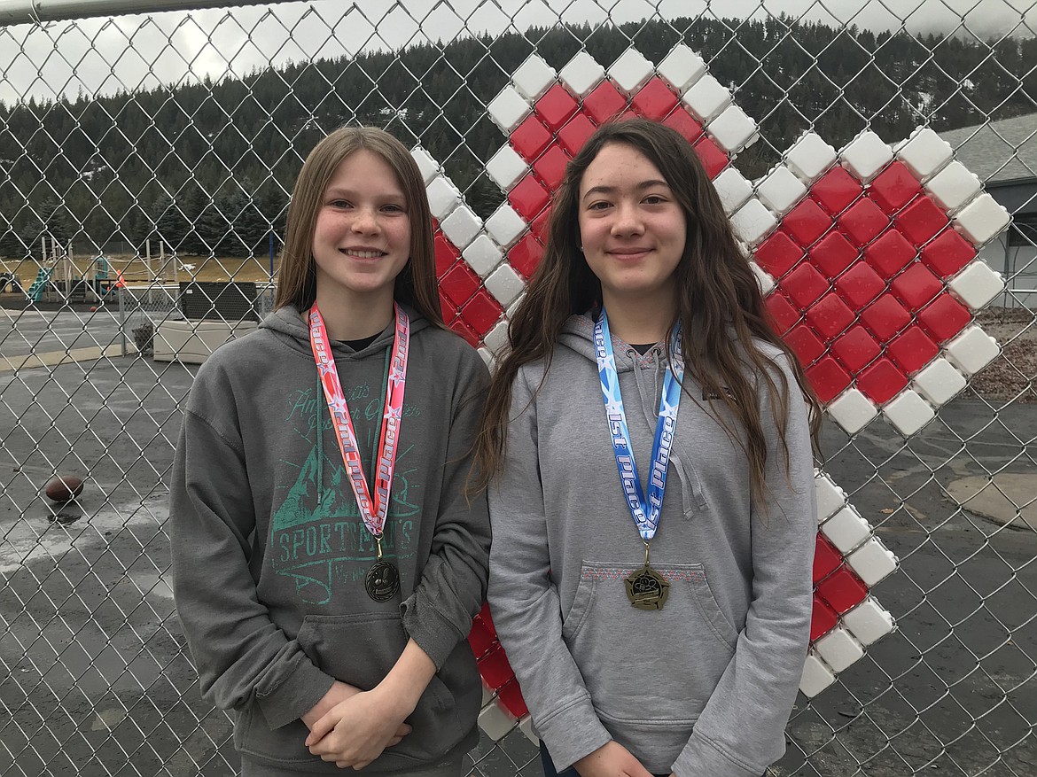 Makenzie Reum, left, was the runner-up, and Abigail Wheeler, right, was the winner of the Superior Schools spelling bee. (Photo courtesy of Superior Schools)