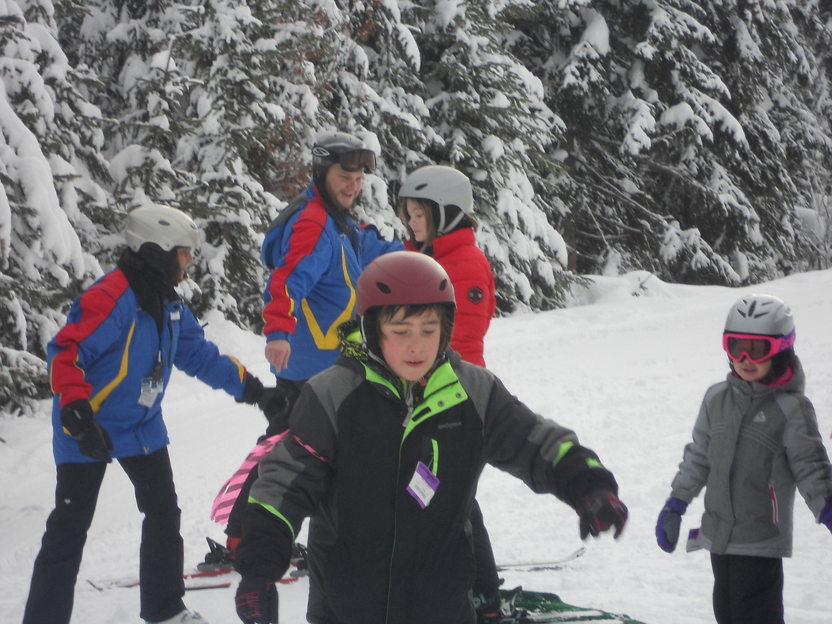 Superior students Zach May and Aleacia Rogers learn the basics during the recent ski trip. (Photo courtesy Superior School)