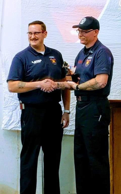 Courtesy photo 
North Bench Fire Chief Gus Jackson presents North Bench Firefighter Tom Chaney the Firefighter of the Year award.