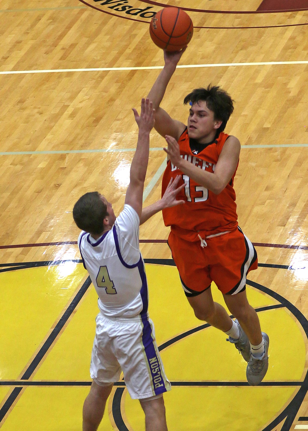 Ronan&#146;s Elijah Tonasket rises up over Polson guard Xavier Fisher in the game last Friday. (Bob Gunderson photo)