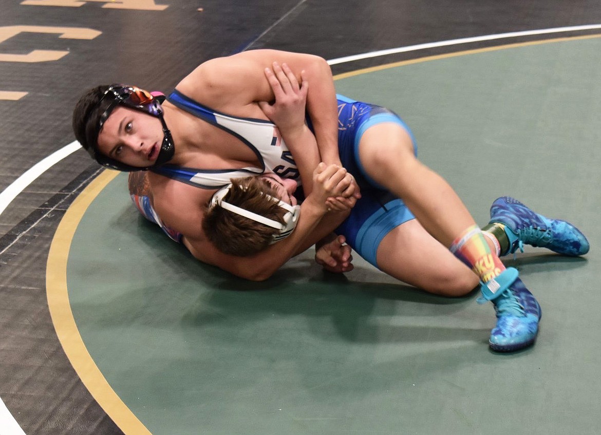 Jace DeShazer prepares to pin his opponent during the Jan. 25 Winter Warrior Classic tournament in Spokane, Wash. (Courtesy photo)
