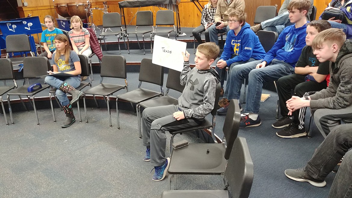 Thompson Falls Junior High held its geographic bee Jan. 28 and eighth-grade student Theo Nygaard, holding up the white board, won the contest. (Chuck Bandel/Valley Press)