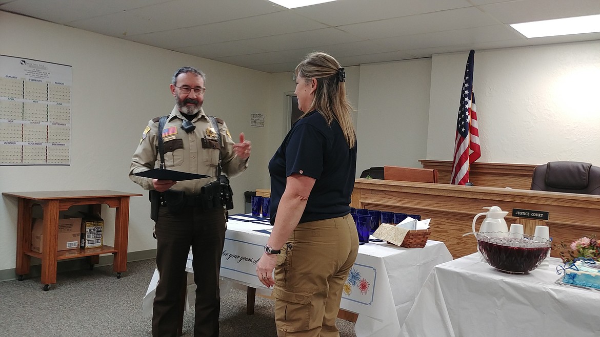 Sanders County Sheriff Tom Rummel presents a 15-year service award to Detention and Dispatch Supervisor Shawna Chenoweth. (Chuck Bandel/Valley Press)