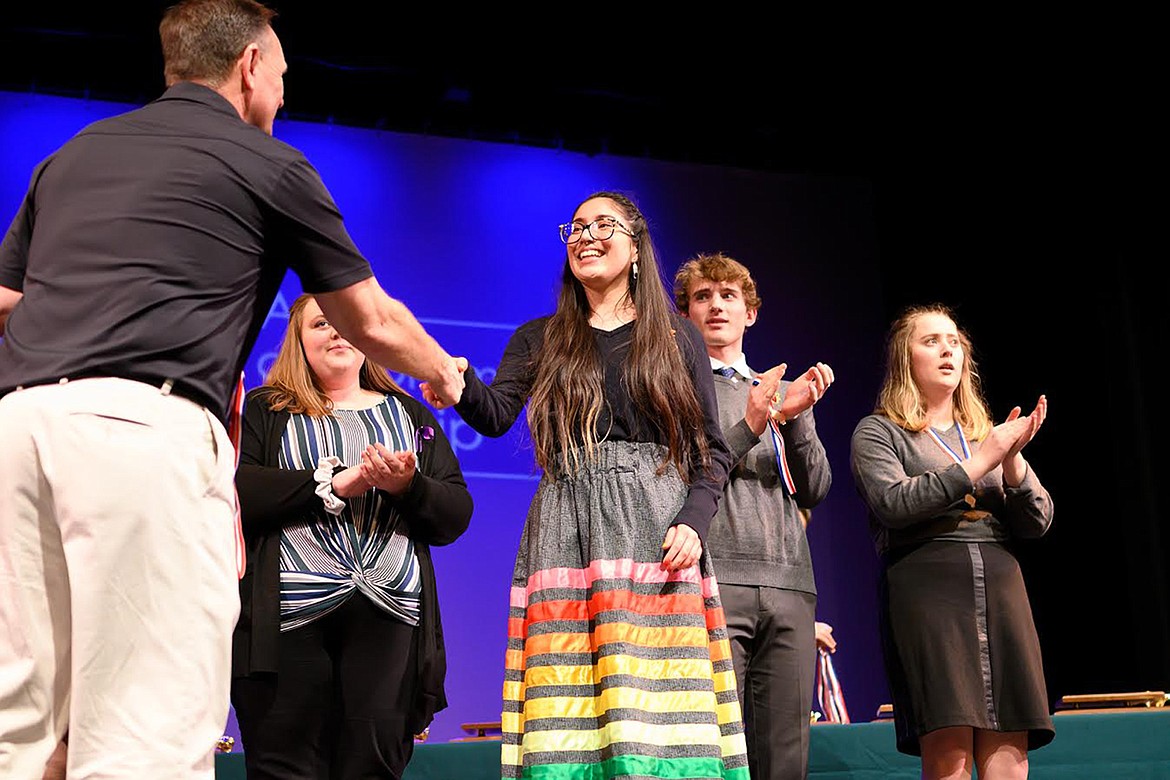 Ronan's Sariel Sandoval is congratulated after placing sixth in oratory at the Class A Montana State Speech and Debate Championships in Whitefish Saturday. (Chris Peterson/Hungry Horse News)