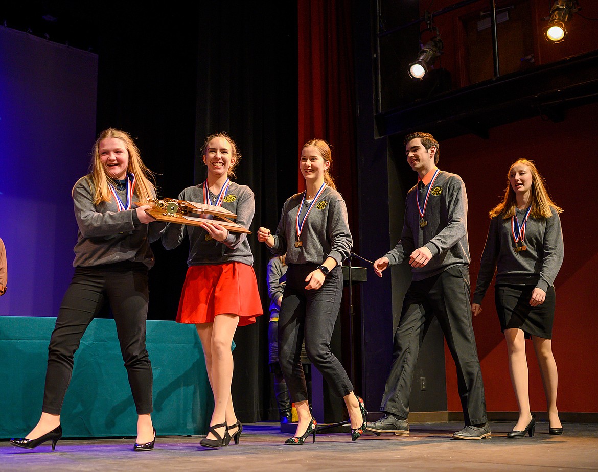 Whitefish state champions, from left, Danika Tintzman (impromptu), Bethany Barnes (informative), Grace Benkelman (memorized public address), Logan Mercer (humorous interpretation), and Abigail Bowden (extemporaneous), accept the team&#146;s plaque for their second place finish at the Class A state speech and debate meet Saturday at the Whitefish Performing Arts Center. (Chris Peterson/Hungry Horse News)