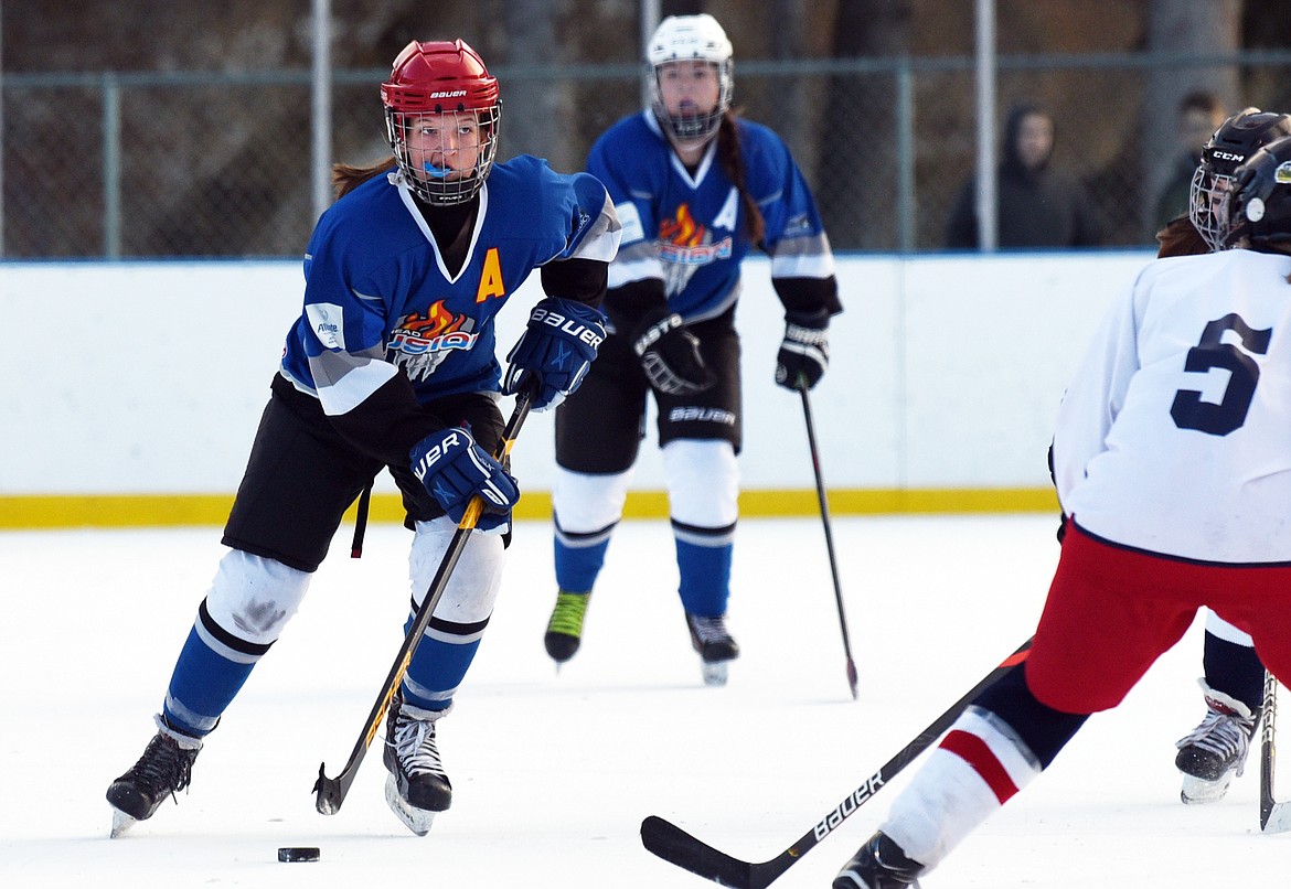 Alexis Kersten (27) scans the ice as she skates with the puck against the Lethbridge Cyclones during the 14U Girls Winter Classic 2020 at the Woodland Ice Center in Kalispell on Friday. (Casey Kreider/Daily Inter Lake)