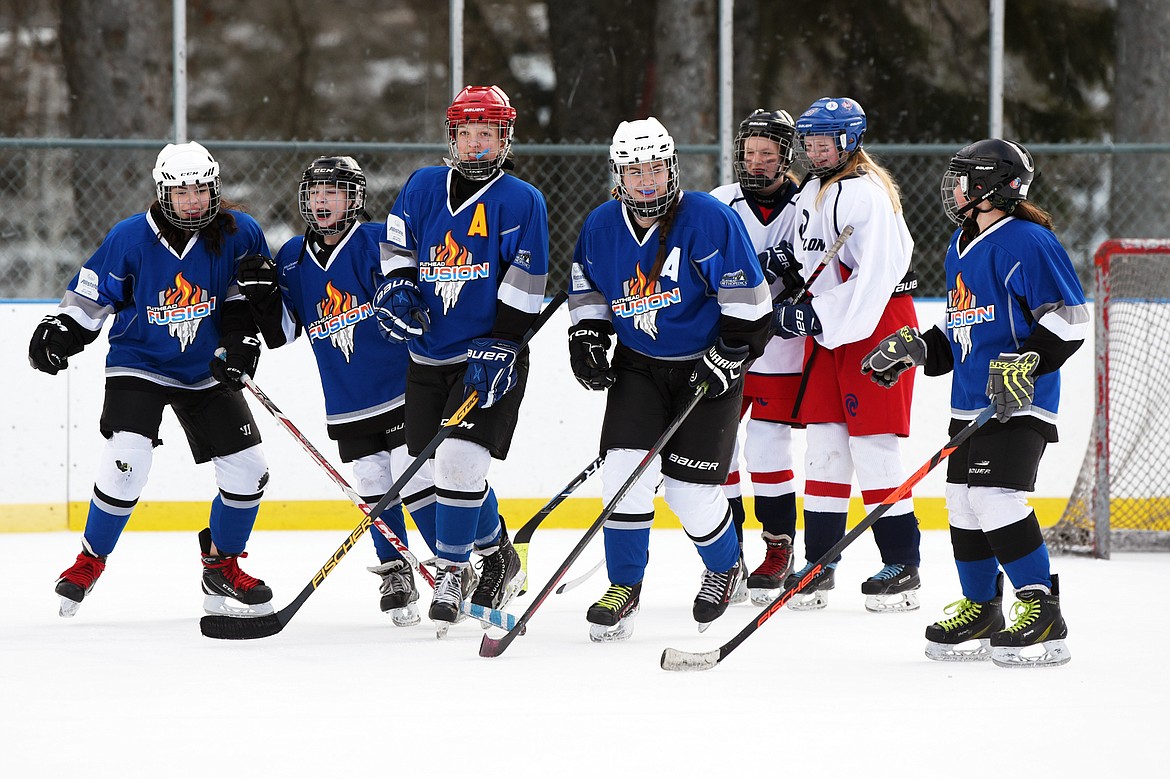 Flathead Lady Fusion players celebrate after a goal against the Lethbridge Cyclones at the recent 14U Girls Winter Classic 2020 at the Woodland Ice Center in Kalispell. (Casey Kreider photos/Daily Inter Lake)