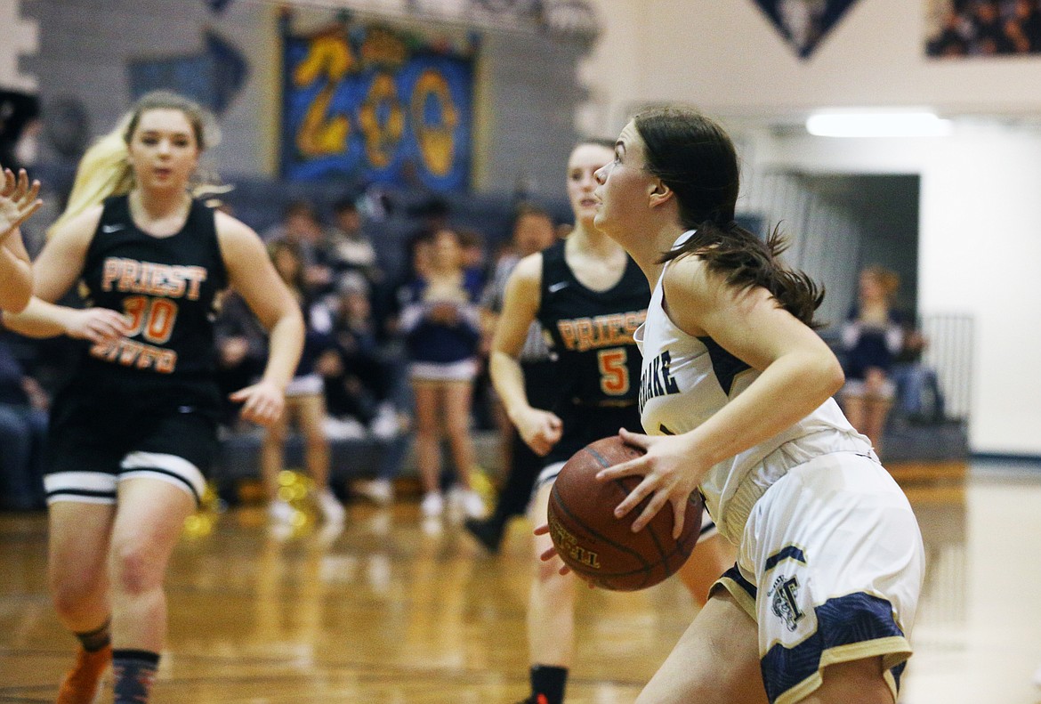 Timberlake&#146;s Bernie Carhart drives to the basket against Priest River.