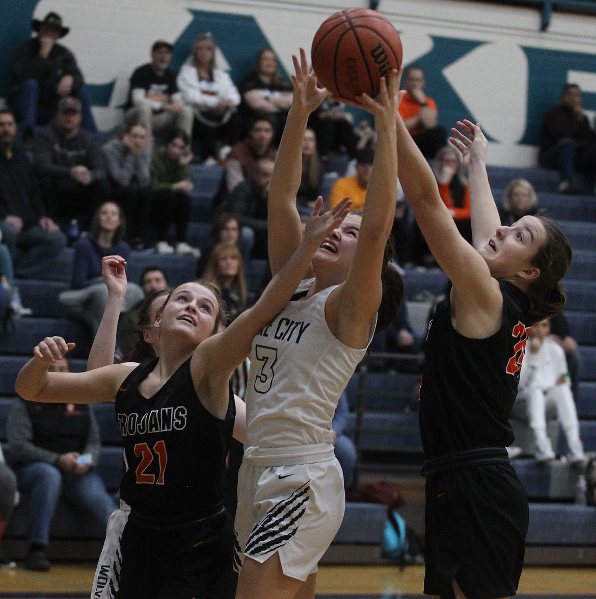 JASON ELLIOTT/Press
From left, Post Falls senior Laney Smith, Lake City senior Madi Chase and Post Falls freshman Capri Sims battle for a rebound in Saturday&#146;s game at Lake City High.