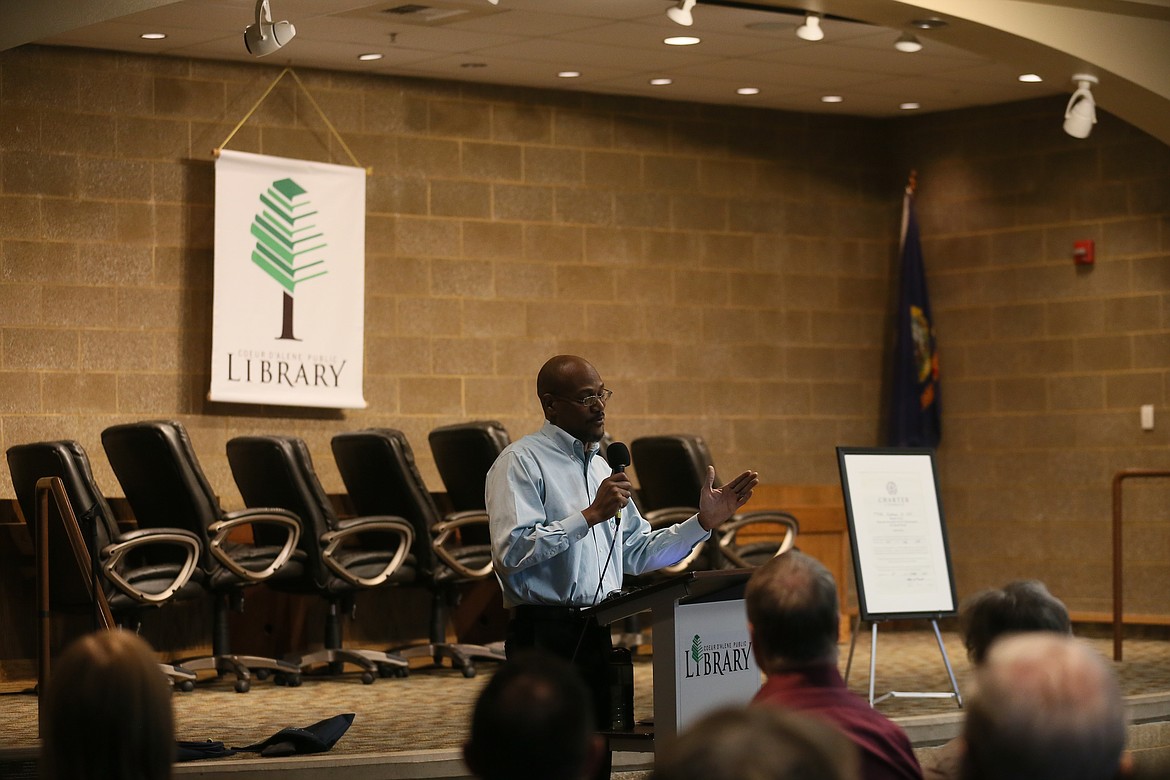 JENNIFER PASSARO/Press
James McDay unveils the charter establishing a National Association for the Advancement of Colored People chapter in Kootenai County. McDay was named chapter chair by NAACP Tri-State Conference President Jeanetta Williams.