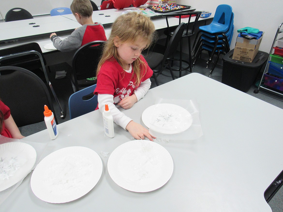 (Courtesy photo)
An Idaho Hill Elementary kindergartner works on a &#147;Snow White Mystery Science&#148; project making snow flakes as part of a STEaM activity at the school recently.