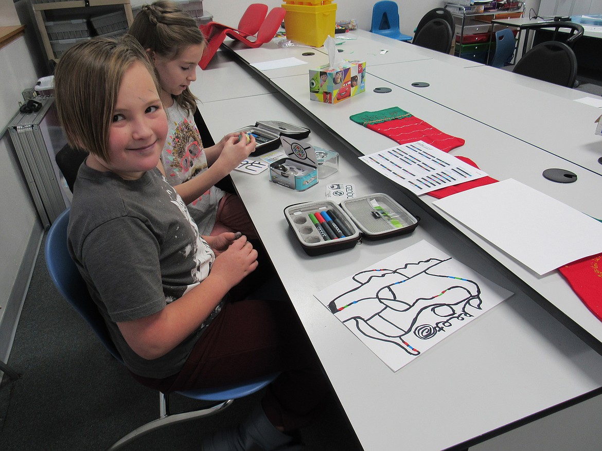 (Courtesy photo)An Idaho Hill Elementary fourth grader smiles during a session with Ozobot bits coding for National Hour of Code recently. The activity was just one of many the school did as part of its STEaM &#151; Science Math Engineering Arts and Math &#151; program.