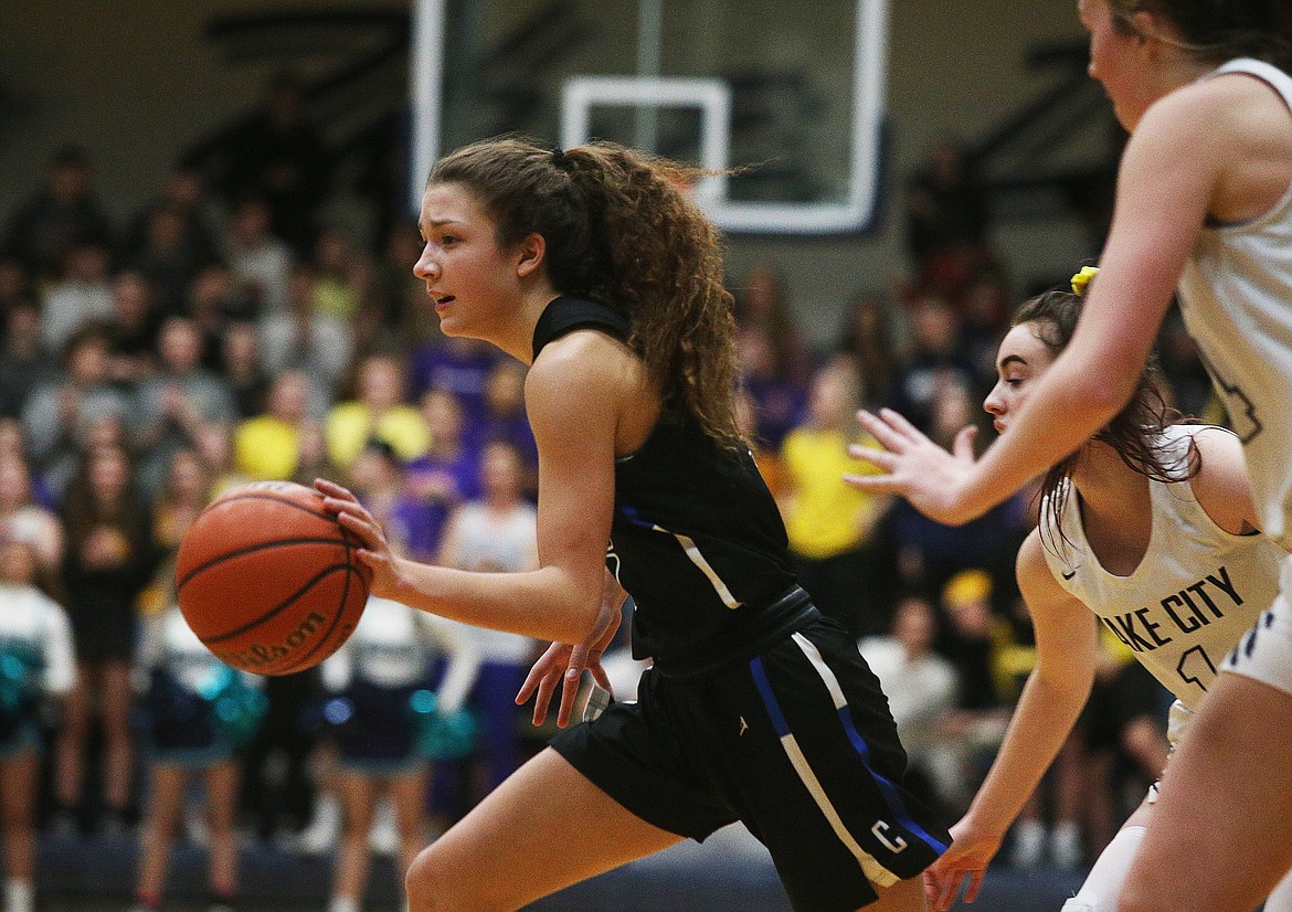 Coeur d&#146;Alene High&#146;s Jaelyn Brainard-Adams dribbles the basketball down the court against Lake City during Wedensday&#146;s Region 1 championship game at Lake City High. (LOREN BENOIT/Press)