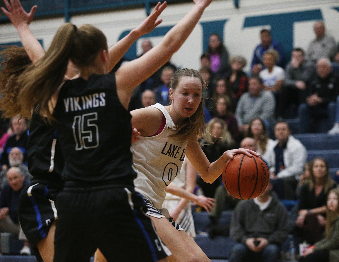 Lake City&#146;s Kendall Pickford dribbles the ball into the Coeur d&#146;Alene Viking defense during Wednesday&#146;s 5A Region 1 championship game at Lake City. (LOREN BENOIT/Press)