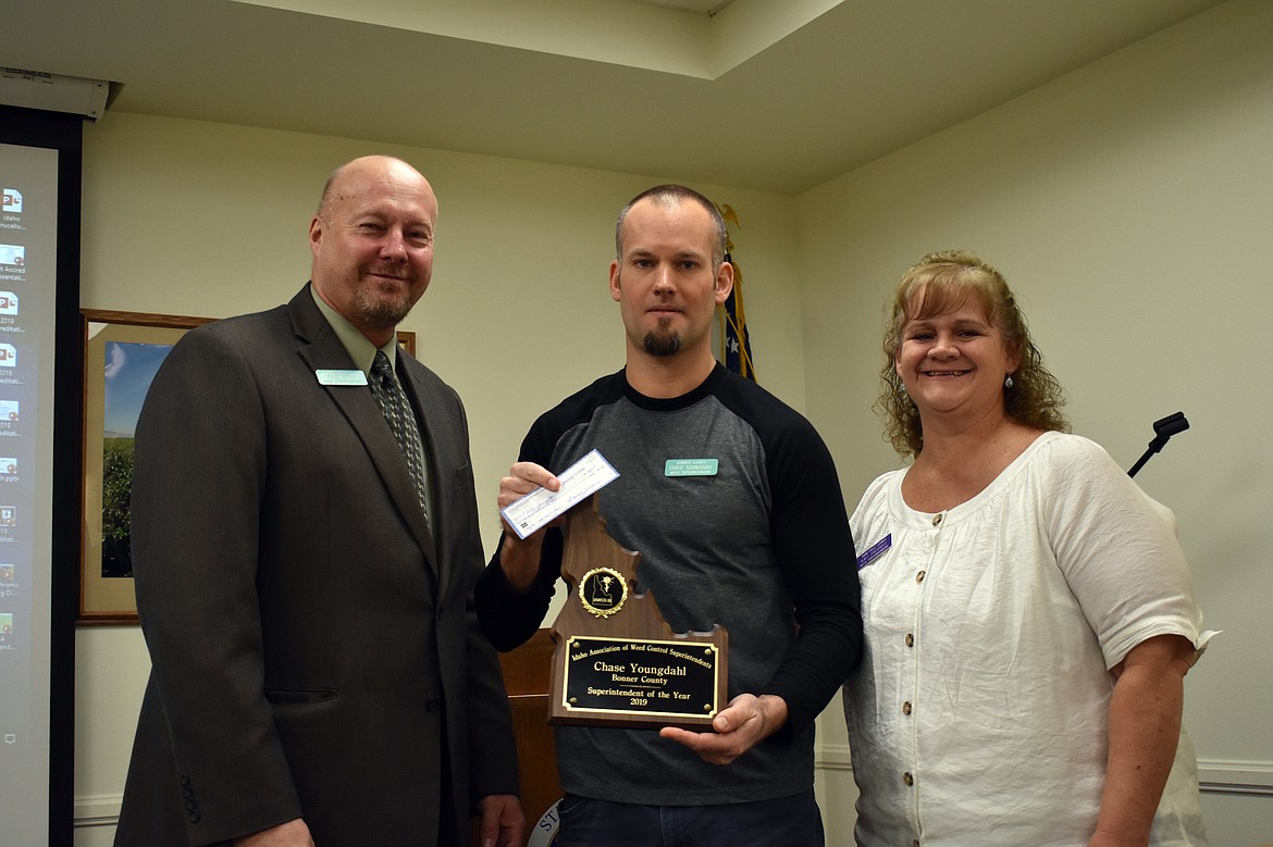 (Courtesy photo)
Chase Youngdahl, center, is presented with his award after being named the Idaho Weed Superintendent of the Year recently.